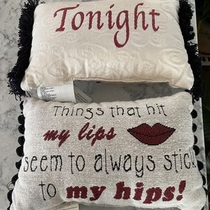 Two small pillows with sayings.